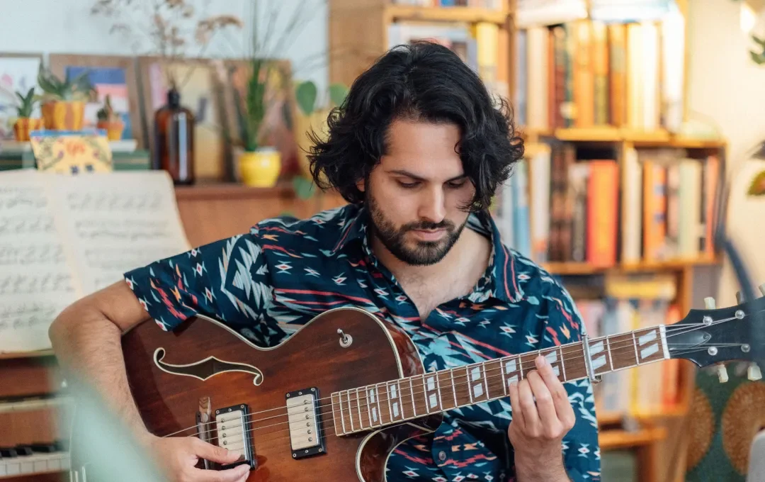 Haroun Iqbal playing guitar
