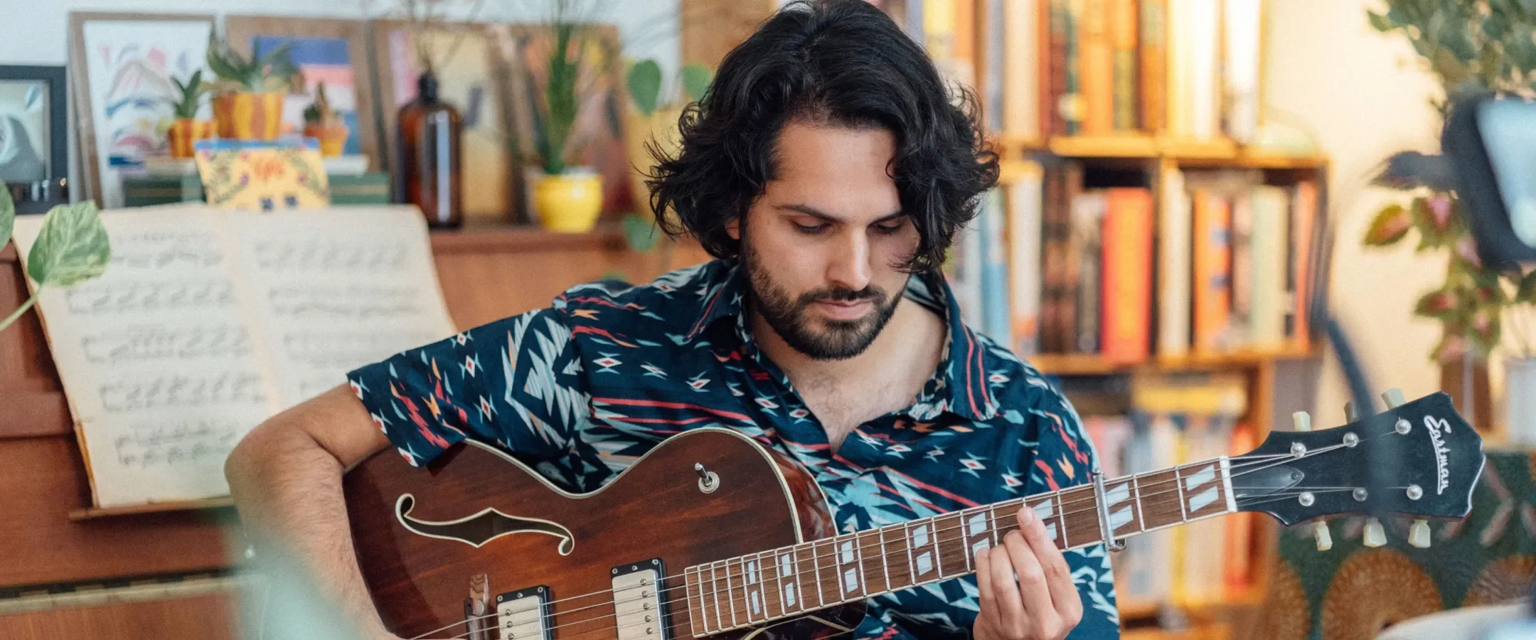 Haroun Iqbal playing guitar